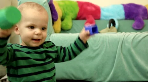 Cute baby boy having fun with blocks FULL HD dolly CLOSE Stock Footage 48975094