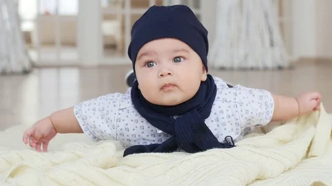 Cute baby boy lying down on blanket Stock Footage 75072646