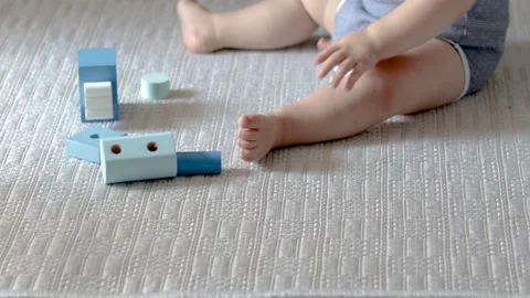 Cute baby boy playing with eco wooden toys,train Vidéo 201524904
