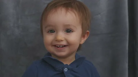 The cute baby boy posing on camera. slow motion Stock Footage 144215204