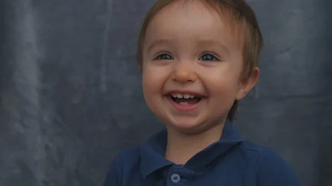 The cute baby boy posing on camera. slow motion Stock Footage 144216620