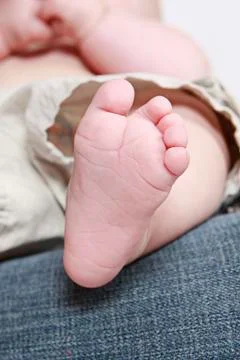 Cute baby boy posing for camera on white background Stock Photos