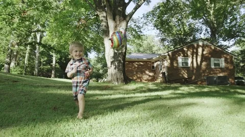 Cute baby boy running in grass field 4k Stock Footage 78486478