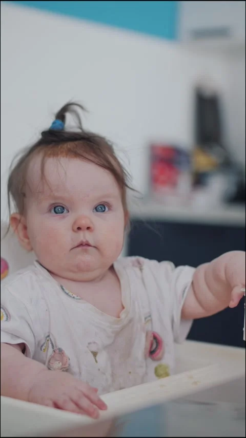 Cute Baby Chewing Spoon During Feeding Time At Home Видео 336182329