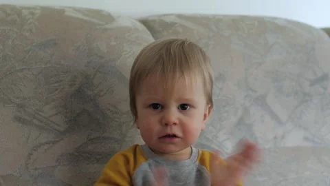 Cute baby claps his hands Stock Footage 317336537