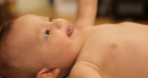 Cute baby, close up flapping hands and sticking out tongue Stock Footage 122862014