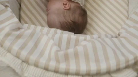 A cute baby in a cot Stock Footage 83031970