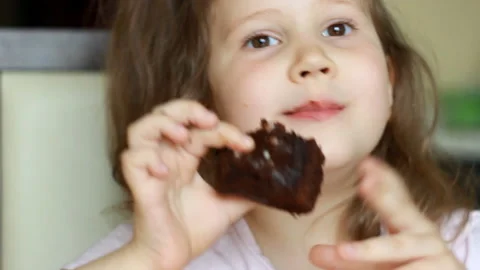 cute baby girl with chocolate