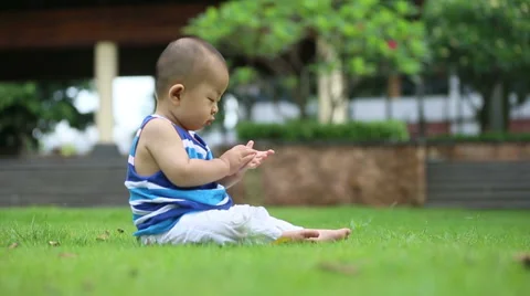 Cute baby on the grass Stock Footage 46971275