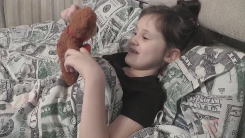 Cute Baby Lying in Bed, Playing With Teddy Bear Stock Footage 72613502