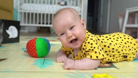 Cute baby newborn smile and lies on his stomach Stock Footage 266820341