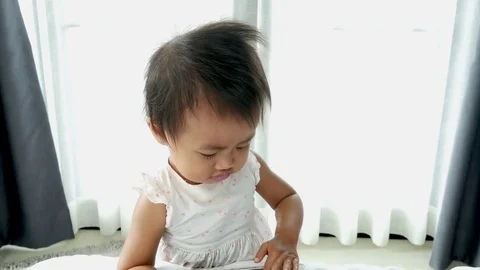 Cute baby playing with digital tablet and dance Video stock 82812480