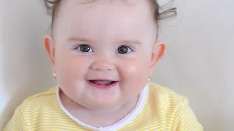 Cute baby smiling at the camera Video stock 53775400