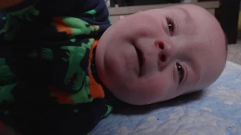 Cute Baby Trying to Grab the Camera Stock Footage 104047663