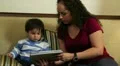 Cute baby watching something on a tablet HD Footage