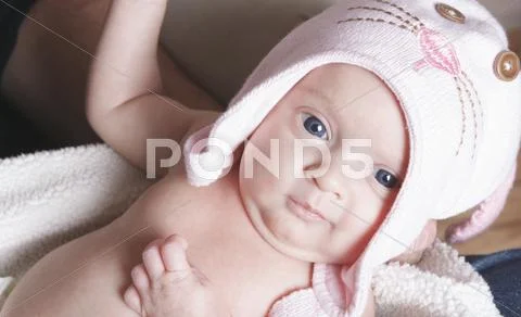 A Cute baby wearing a hat Stock Photos