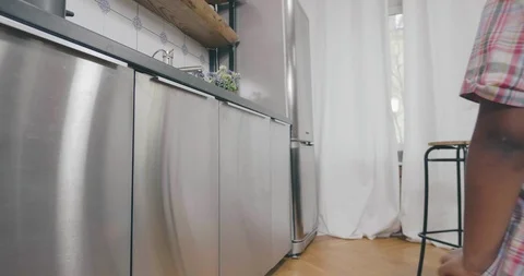 Cute black child taking fruit from fridge Stock Footage 107659350