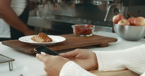 Cute blond girl in a bakery Stock Footage