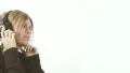 Cute blond on the headphones - 1 -dolly pan around model HD Footage