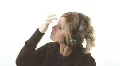 Cute blond on the headphones - 10 - straighten hair and oblivious HD Footage