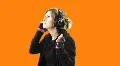 Cute blond on the headphones - 3 - V2 slow dolly around - pre-keyed HD Footage