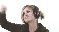 Cute blond on the headphones - 7 - roll, as in rock and roll HD Footage
