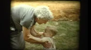 Cute Blonde Baby Boy And Elderly Grandmother Hug And Kiss Stock Footage