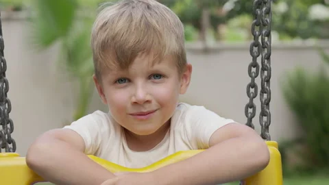 Cute blonde boy without front teeth smiling and looking at camera Stock Footage 205287343