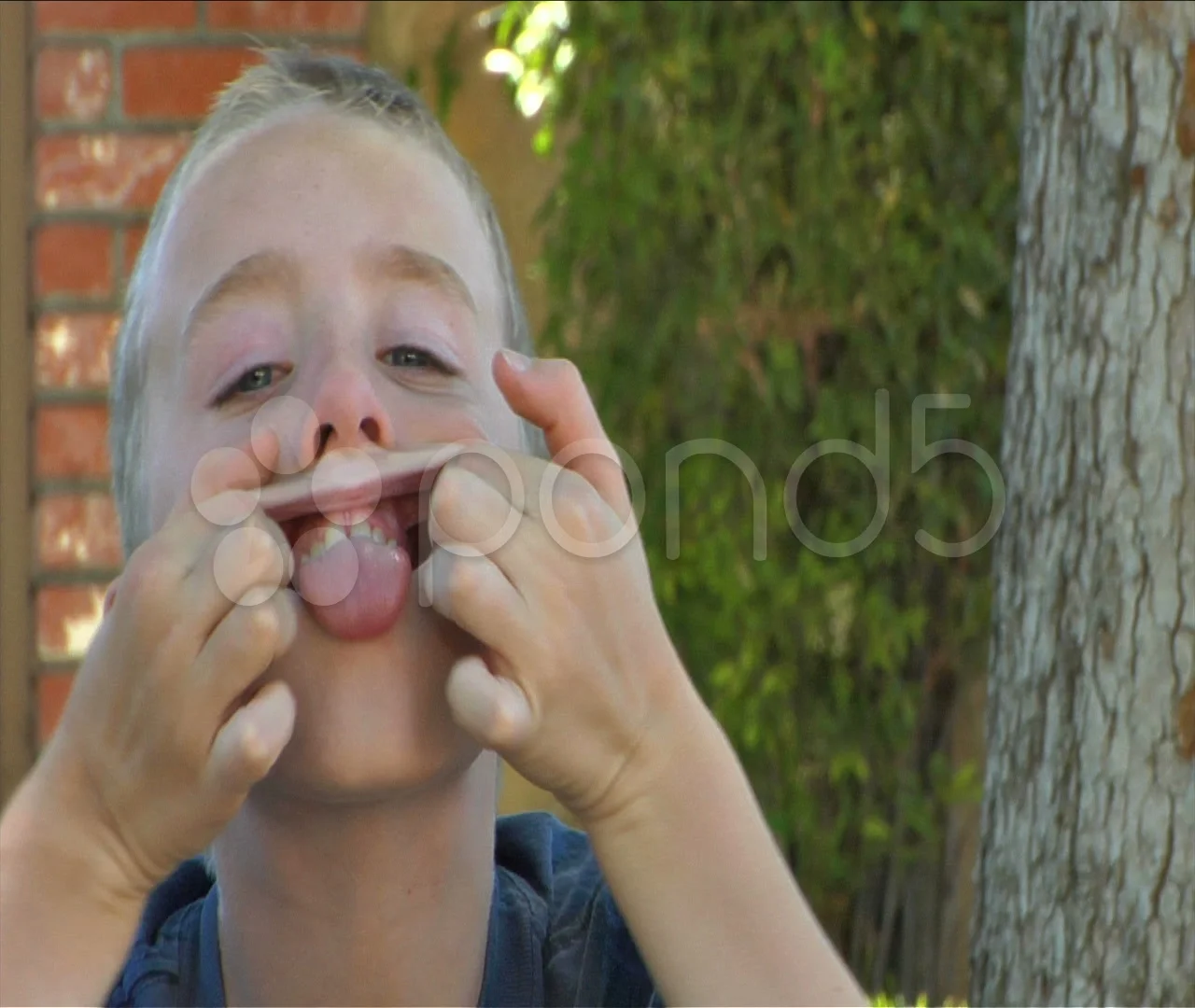 Cute blonde little boy making funny face... | Stock Video | Pond5 Cute blonde little boy making funny face... | Stock Video | Pond5