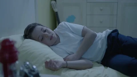 Cute blonde is resting alone on the bed in the nursery. Video stock 198376195