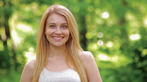 Cute blonde is smiling. Stock Footage 75818524
