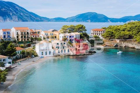 Cute blue sea bay in front of Assos village. Beautiful view to vivid colorful Stock Photos