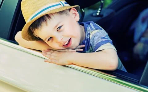 Cute boy bored in the car Stock Photos