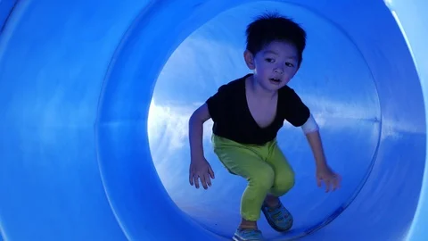 Cute boy cheerful playing in playground Stock Footage 113395413