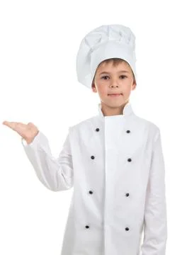 Cute boy in chef uniform on light background Stock Photos