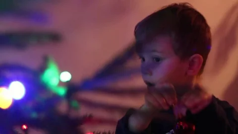 Cute boy decorating christmas tree Stock Footage 83871473