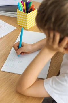 Cute boy doing school homework at home. Distance education. Online education. Stock-Fotos