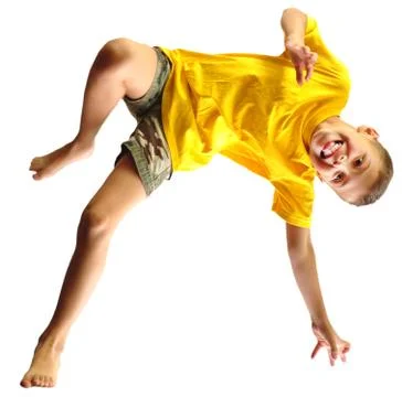Cute boy exercising, dancing and jumping over white Stock Photos