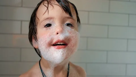 Cute boy with foam on face 動画素材 132958312