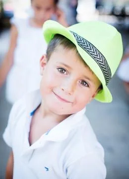 Cute boy in a hat on a background of nature Stock Photos
