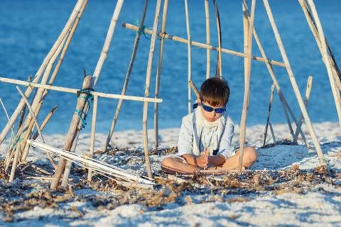 Cute boy having fun at beach Stock Photos