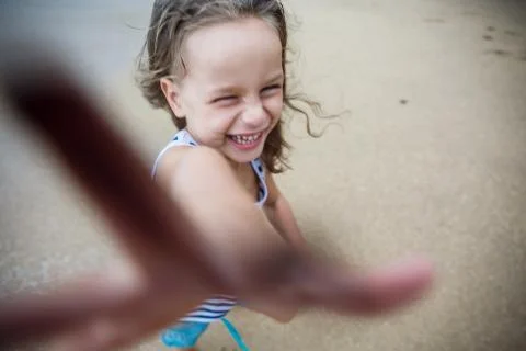 Cute boy is having fun on the beach Stock Photos