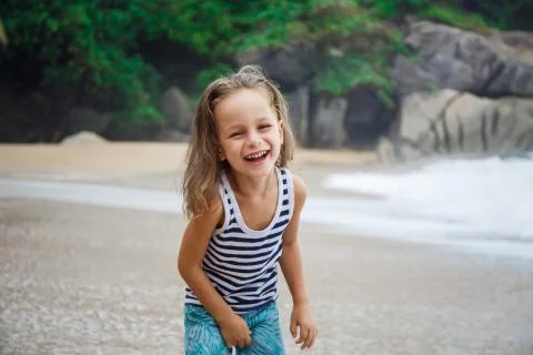 Cute boy is having fun on the beach Stock Photos