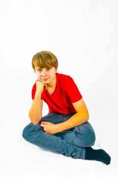 Cute boy leans on his head with his arm Stock Photos