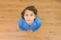 The cute boy look to the camera. View from above Photo