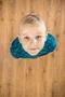 The cute boy look up. View from above Photo