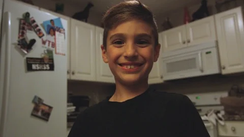 Cute boy looking at the camera and smiling Stock Footage 90663721