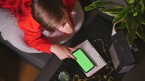 Cute boy lying on sofa using smart phone Stock Footage 144172352