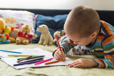 Cute boy painting and drawing at home. Children's creativity. Stock Photos