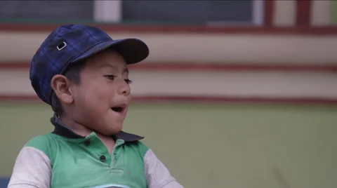 Cute boy playing with a black funnel, Guatemala Stock Footage 63054411